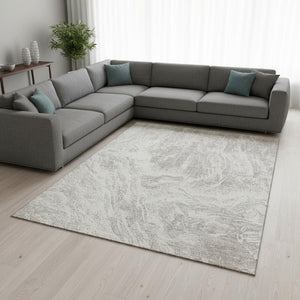 HomeRoots 9' X 12' Abstract Beige and Ivory Area Rug - Washable, UV Protected, Stain-Resistant for High-Traffic Areas 676763