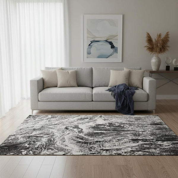HomeRoots 5' X 8' Black And Ivory Abstract Area Rug - Stylish, Washable, UV-Protected & Perfect for Any Space! 676766
