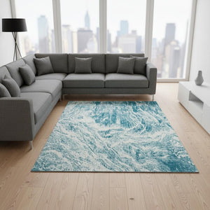 HomeRoots 8' X 10' Teal And Ivory Abstract Area Rug - Washable, UV Protected, Durable Design for Modern Spaces 676804