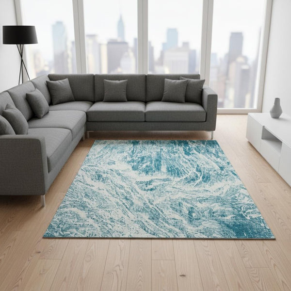 HomeRoots 8' X 10' Teal And Ivory Abstract Area Rug - Washable, UV Protected, Durable Design for Modern Spaces 676804