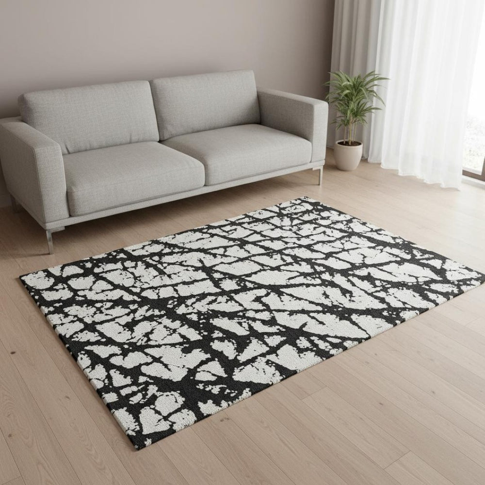 HomeRoots 5' X 8' Abstract Black And Ivory Washable Area Rug - Stylish, Durable, UV Protected for Homes 676808