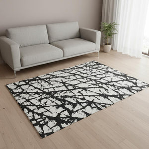 HomeRoots 5' X 8' Abstract Black And Ivory Washable Area Rug - Stylish, Durable, UV Protected for Homes 676808