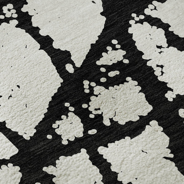 HomeRoots 8' Black And Ivory Abstract Round Rug - Washable, UV Protected, Durable Design for Modern Homes 676809