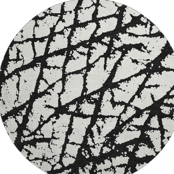 HomeRoots 8' Black And Ivory Abstract Round Rug - Washable, UV Protected, Durable Design for Modern Homes 676809