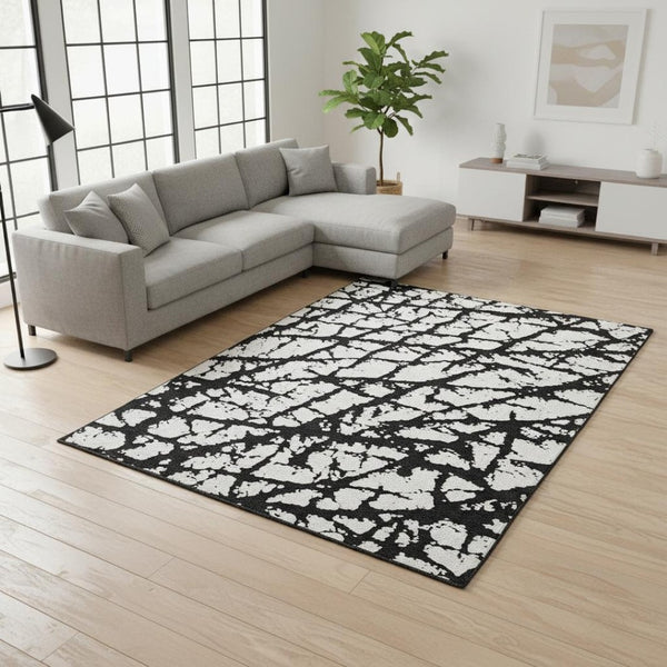HomeRoots 8' X 10' Abstract Black and Ivory Washable Area Rug with UV Protection for High-Traffic Spaces 676810