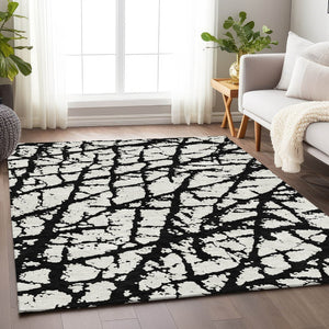 HomeRoots 8' X 10' Abstract Black and Ivory Washable Area Rug with UV Protection for High-Traffic Spaces 676810