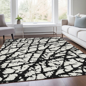 HomeRoots 8' X 10' Abstract Black and Ivory Washable Area Rug with UV Protection for High-Traffic Spaces 676810