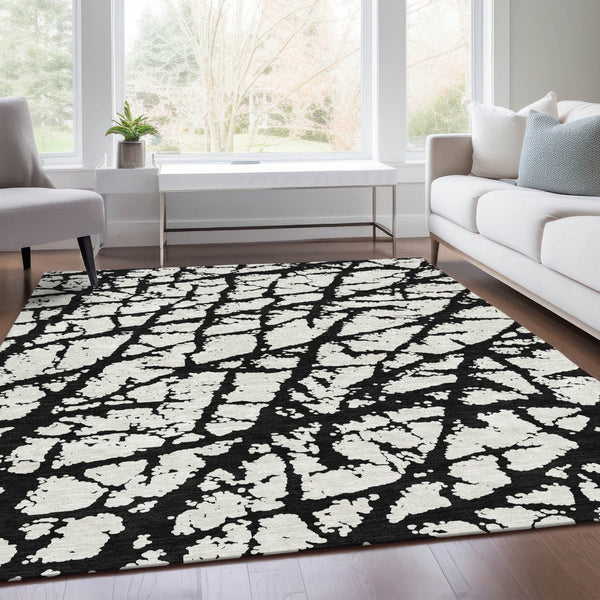 HomeRoots 8' X 10' Abstract Black and Ivory Washable Area Rug with UV Protection for High-Traffic Spaces 676810