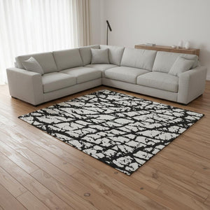 HomeRoots 10' X 14' Black And Ivory Abstract Area Rug - Washable, UV Resistant, Perfect for High-Traffic Areas 676812