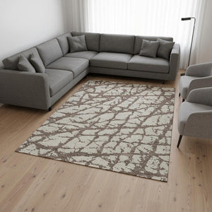 HomeRoots 9' x 12' Washable Brown and Beige Abstract Area Rug with UV Protection for Modern Living Spaces 676823