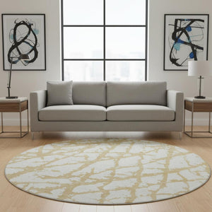 HomeRoots 8' Gold And Ivory Abstract Round Rug – Washable, Stain Resistant, UV Protected for Modern Homes 676833