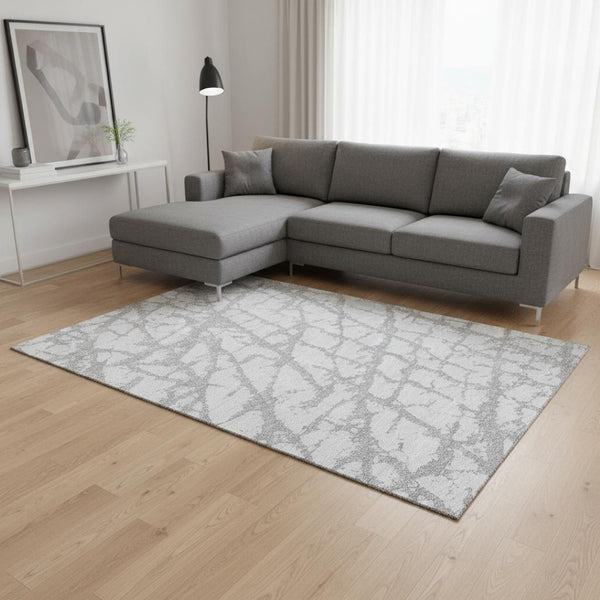 HomeRoots 10' X 14' Silver and Gray Abstract Area Rug - Washable, UV-Protected, Durable for Modern Living Spaces 676878