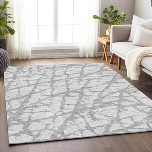 HomeRoots 10' X 14' Silver and Gray Abstract Area Rug - Washable, UV-Protected, Durable for Modern Living Spaces 676878