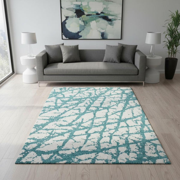 HomeRoots 5' X 8' Teal and Ivory Abstract Area Rug - Washable, UV Resistant, Perfect for Homes with Kids & Pets 676880