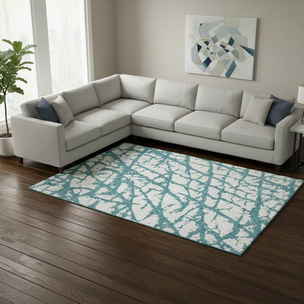 HomeRoots 9' X 12' Teal & Ivory Abstract Washable Area Rug – Stylish, Durable, Stain Resistant with UV Protection 676883