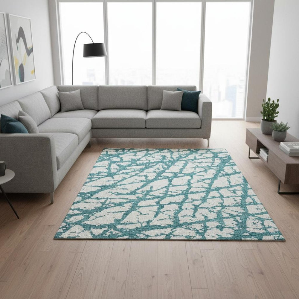 HomeRoots 10' X 14' Teal & Ivory Abstract Washable Area Rug – Durable, UV-Protected for Busy Homes & Style! 676884