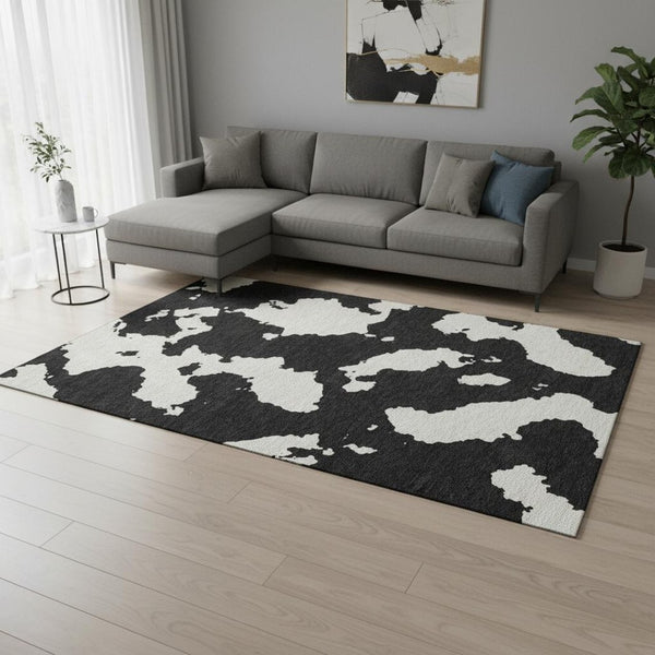 HomeRoots 10' X 14' Black And Ivory Abstract Area Rug - Washable, UV Protected, Perfect for High-Traffic Spaces! 677004
