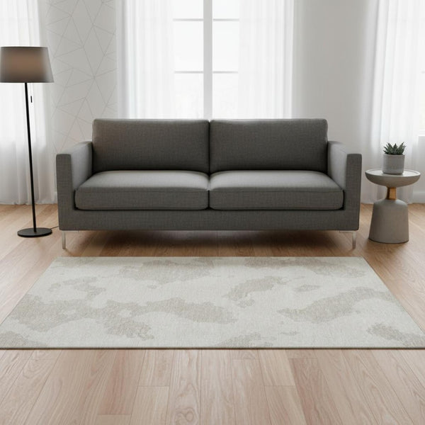 HomeRoots 5' X 8' Abstract Ivory and Beige Washable Area Rug with UV Protection for Modern Living Spaces 677036