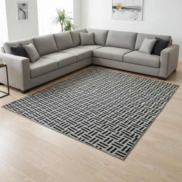 HomeRoots 9' X 12' Modern Black And Ivory Geometric Area Rug - Washable, UV Protected, Durable & Stylish Decor 677218