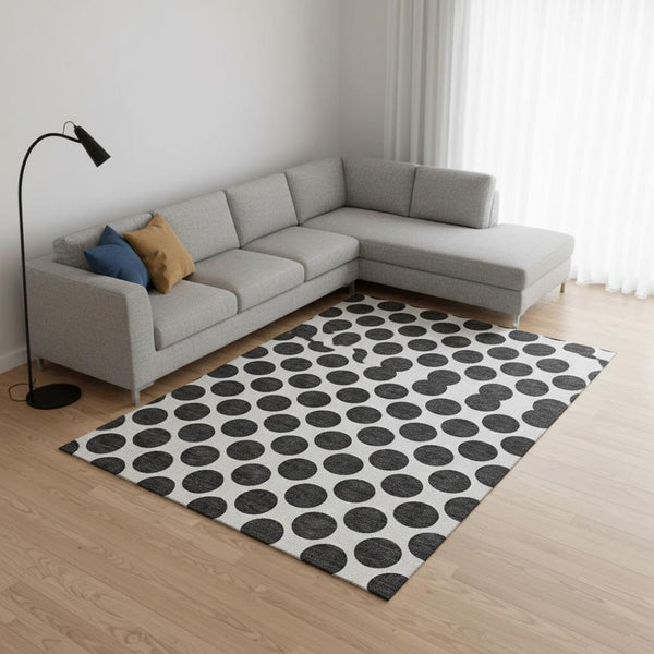 HomeRoots 9' X 12' Washable Black and Ivory Polka Dot Area Rug with UV Protection for High-Traffic Spaces 677368