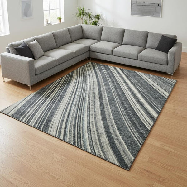 HomeRoots 9' X 12' Stylish Black Gray Ivory Striped Washable Area Rug with Stain Resistance & UV Protection 677458