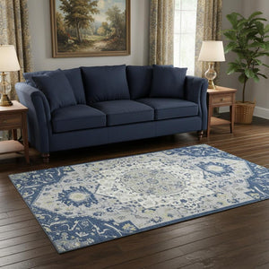 HomeRoots 5' X 8' Navy Blue Ivory Green Washable Area Rug – Stain-Resistant, UV Protected for High Traffic Areas 677773