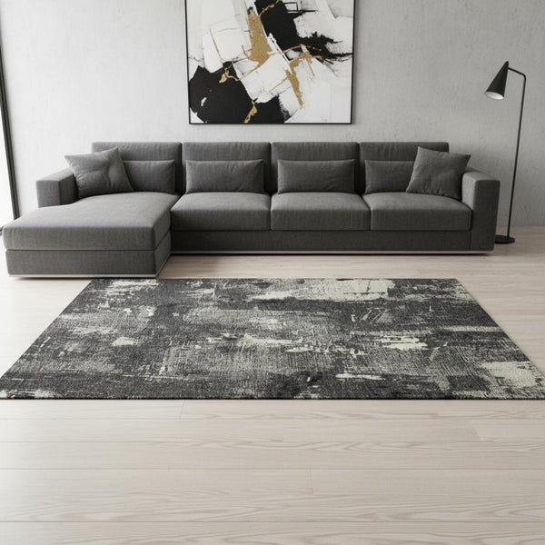 HomeRoots 8' X 10' Stylish Black and Ivory Abstract Washable Area Rug with UV Protection for Modern Homes 677979