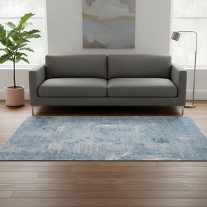 HomeRoots 5' X 8' Denim Blue & Ivory Abstract Rug - Stain Resistant, UV Protected, Easy Care for Family Spaces 677989