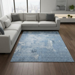 HomeRoots 8' X 10' Denim Blue & Ivory Abstract Area Rug - Washable, UV Protected, Ideal for High-Traffic Spaces 677991