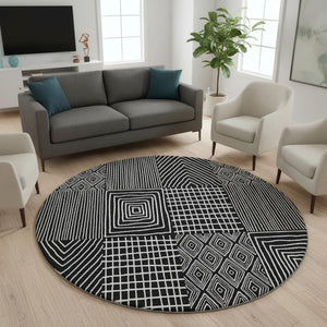 HomeRoots 8' Black and Ivory Geometric Washable Round Rug - Durable, Stylish, UV-Protected for Family Spaces 678038
