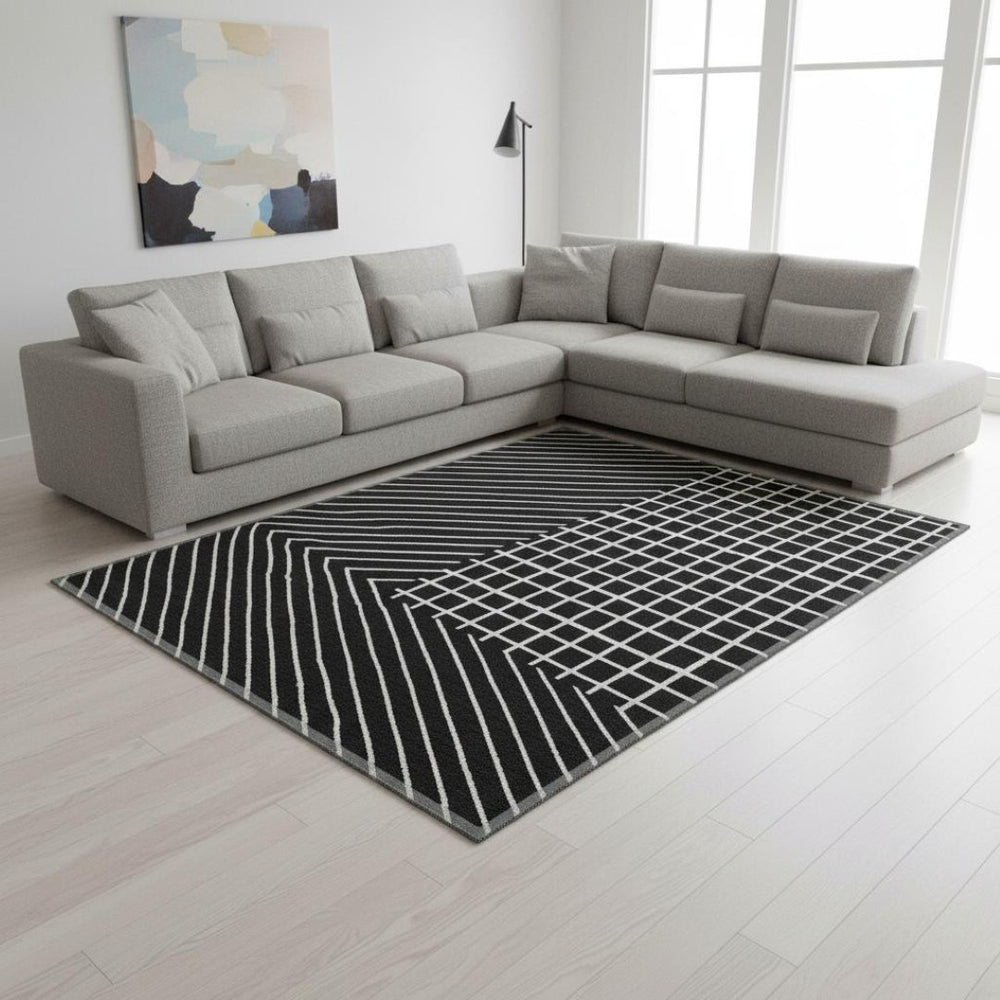 HomeRoots 8' X 10' Black and Ivory Geometric Washable Area Rug with UV Protection for High-Traffic Spaces 678039