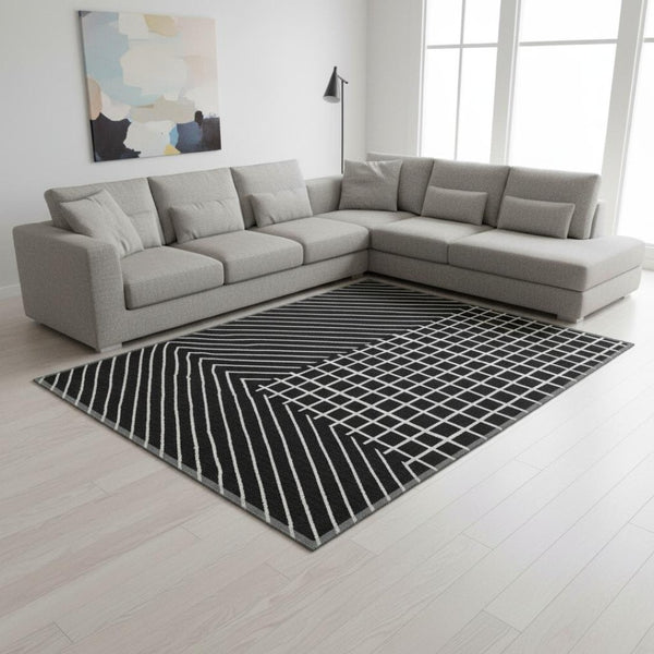 HomeRoots 8' X 10' Black and Ivory Geometric Washable Area Rug with UV Protection for High-Traffic Spaces 678039