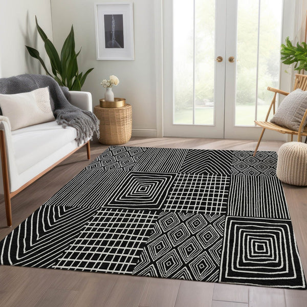 HomeRoots 9' X 12' Black and Ivory Geometric Area Rug - Washable, UV Protected, Durable for Busy Homes! 678040
