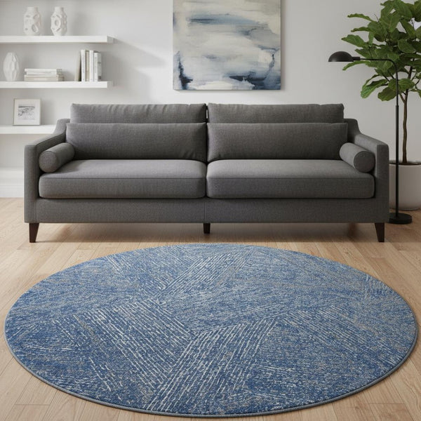 HomeRoots 8' Navy Blue and Ivory Abstract Washable Round Rug - Stain Resistant, UV Protection for Modern Homes 678164