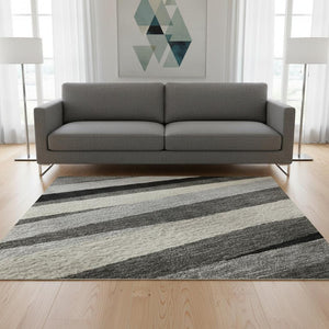 HomeRoots 5' X 8' Striped Area Rug in Gray, Silver & Beige - Washable, UV Protected, Perfect for High-Traffic Areas 678486