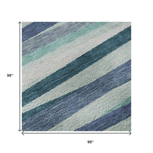 HomeRoots 8' Teal Ivory and Blue Striped Washable Round Rug – Durable, UV-Protected, Ideal for Indoor & Outdoor Use 678523
