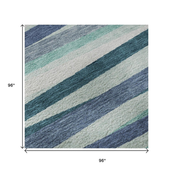 HomeRoots 8' Teal Ivory and Blue Striped Washable Round Rug – Durable, UV-Protected, Ideal for Indoor & Outdoor Use 678523