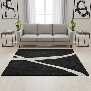 HomeRoots 5' X 8' Washable Black and Ivory Abstract Area Rug with UV Protection for High-Traffic Areas 678618