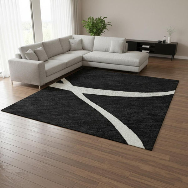 HomeRoots 8' X 10' Black and Ivory Abstract Area Rug - Washable, UV Protected, Perfect for High-Traffic Rooms! 678620