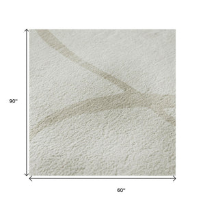 HomeRoots 5' X 8' Ivory and Beige Abstract Area Rug – Machine Washable, Stain Resistant, UV Protected Beauty 678648