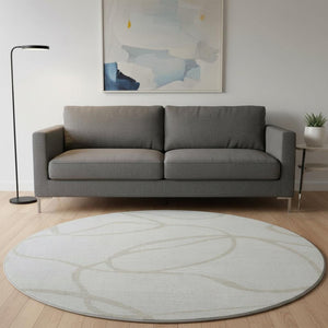 HomeRoots 8' Ivory and Beige Abstract Round Rug - Washable, UV Protected, Stain Resistant for High-Traffic Areas 678649