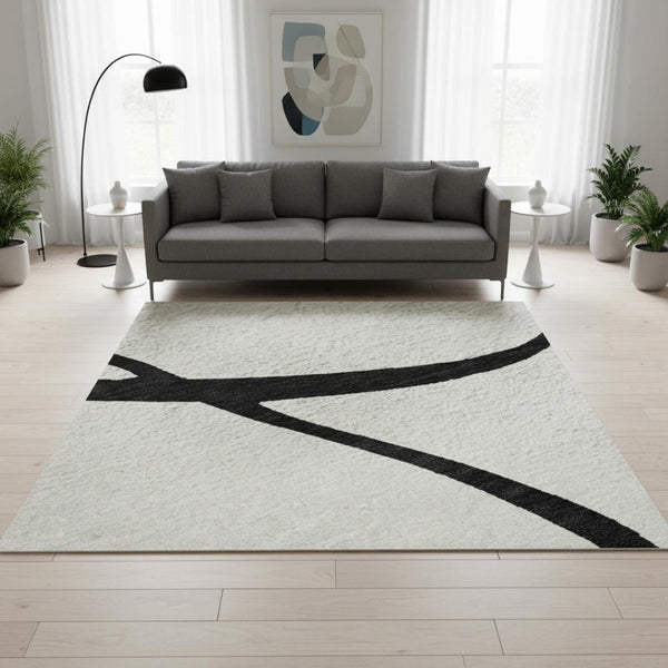 HomeRoots 5' X 8' White and Black Abstract Area Rug - Washable, UV Protected, Stylish for High-Traffic Spaces 678690