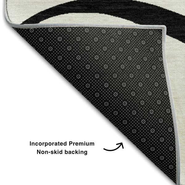 HomeRoots 5' X 8' White and Black Abstract Area Rug - Washable, UV Protected, Stylish for High-Traffic Spaces 678690