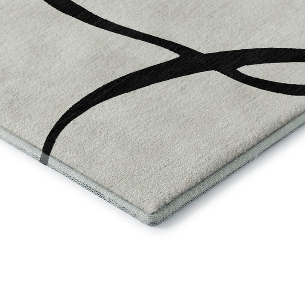 HomeRoots 5' X 8' White and Black Abstract Area Rug - Washable, UV Protected, Stylish for High-Traffic Spaces 678690
