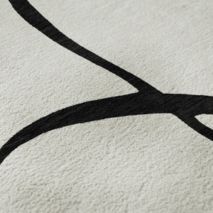HomeRoots 5' X 8' White and Black Abstract Area Rug - Washable, UV Protected, Stylish for High-Traffic Spaces 678690