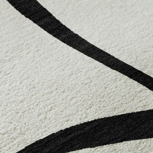 HomeRoots 5' X 8' White and Black Abstract Area Rug - Washable, UV Protected, Stylish for High-Traffic Spaces 678690