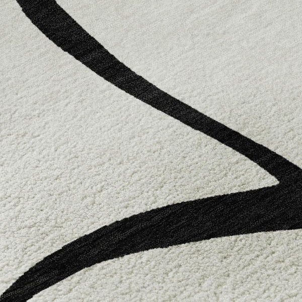 HomeRoots 5' X 8' White and Black Abstract Area Rug - Washable, UV Protected, Stylish for High-Traffic Spaces 678690