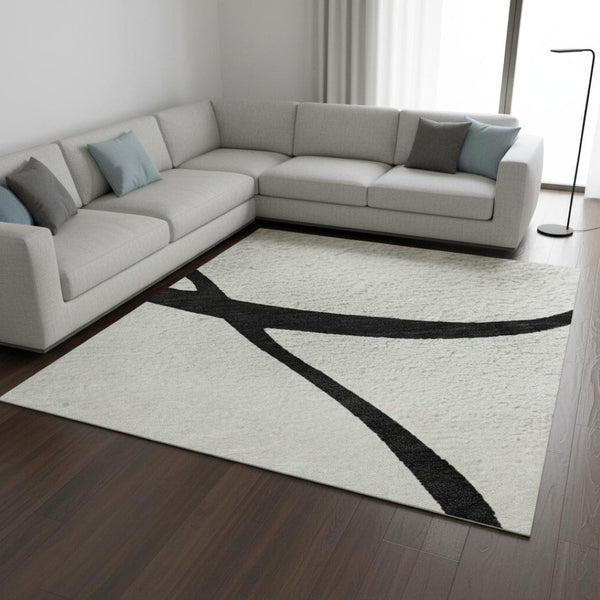 HomeRoots 10' X 14' Stylish White & Black Abstract Washable Area Rug with UV Protection for Modern Homes 678694