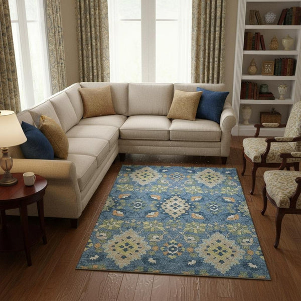 HomeRoots 10' X 14' Blue Peach & Fern Green Oriental Washable Area Rug - UV Protected, Stain Resistant Beauty 678838