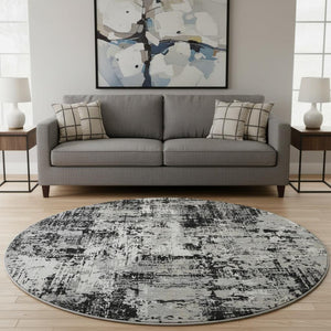 HomeRoots 8' Modern Abstract Washable Round Rug - Black, Ivory & Gray with UV Protection for High Traffic Areas 679093